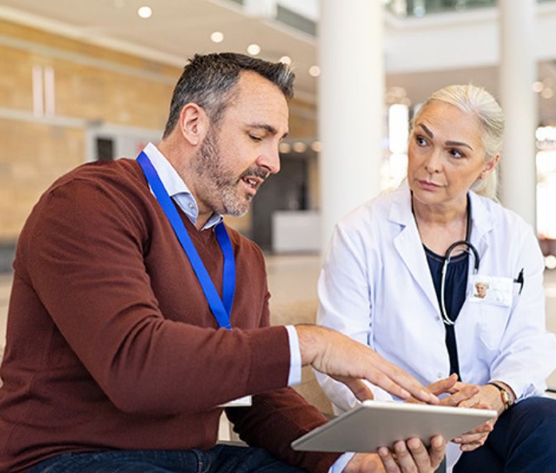 Worker explaining to a doctor